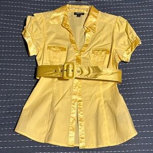 Light yellow button up blouse with satiny accents and belt. Fitted waist.